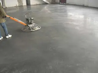 Garage slab finishing with power trowel