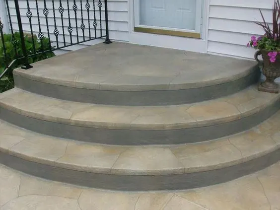 Rounded porch steps with railing