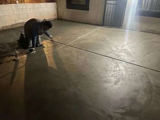 Garage floor finishing detail at night